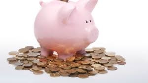 Piggy bank with pennies demonstrating the affordability of our photo booths